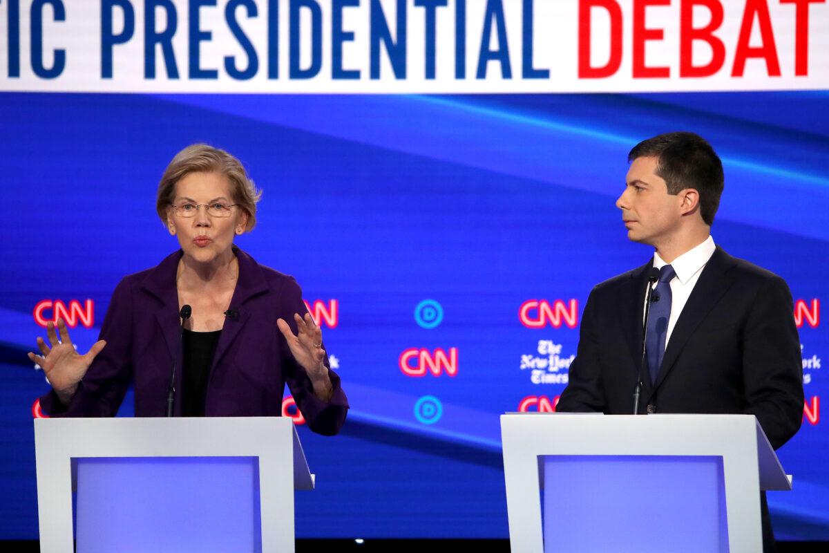 Sen. Elizabeth Warren (D-Mass.) speaks as South Bend, Indiana Mayor Pete Buttigieg looks on during the Democratic Presidential Debate at Otterbein University in Westerville, Ohio on Oct. 15, 2019. (Photo by Win McNamee/Getty Images)