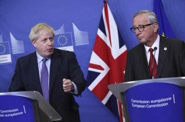 British Prime Minister Boris Johnson and European Commission President Jean-Claude Juncker make prepared statements during a press point at EU headquarters in Brussels on Oct. 17, 2019. (Francisco Seco/AP Photo)