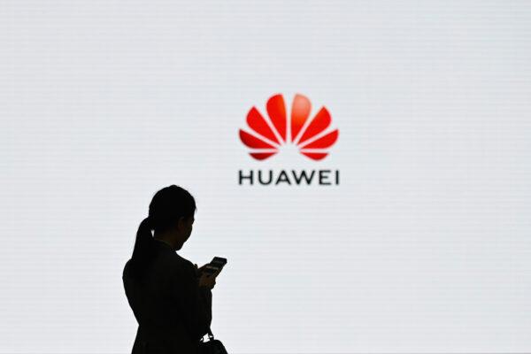 A staff member of Huawei uses her mobile phone at the Huawei Digital Transformation Showcase in Shenzhen, China's Guangdong province on March 6, 2019 (Wang Zhao/AFP/Getty Images)