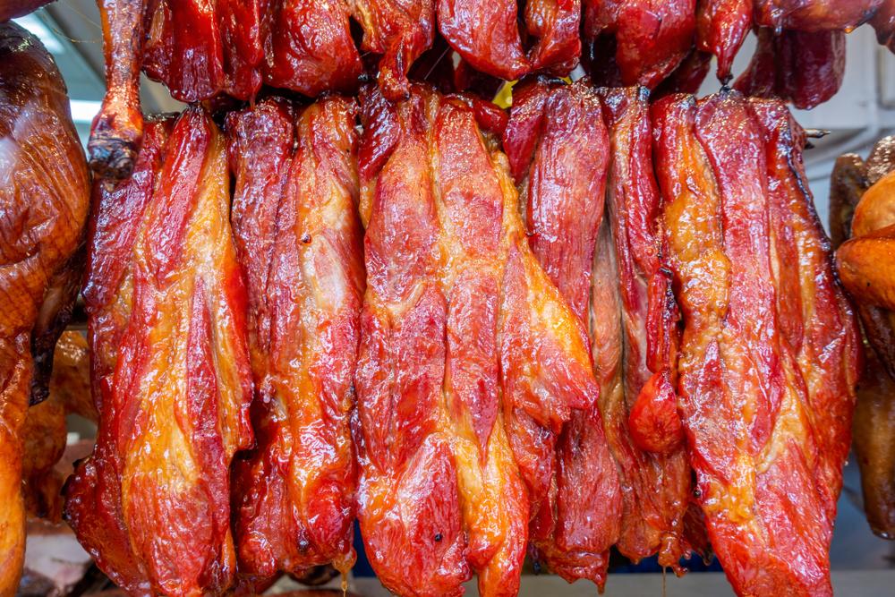 Char siu hanging in the window of a Cantonese barbecue shops. (Shutterstock)