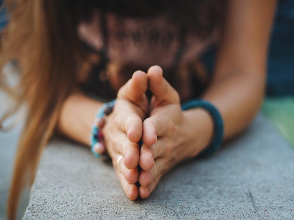 Illustration - Shutterstock | <a href="https://www.shutterstock.com/image-photo/woman-hands-together-symbolizing-prayer-gratitude-707905822">Kristina Kokhanova</a>