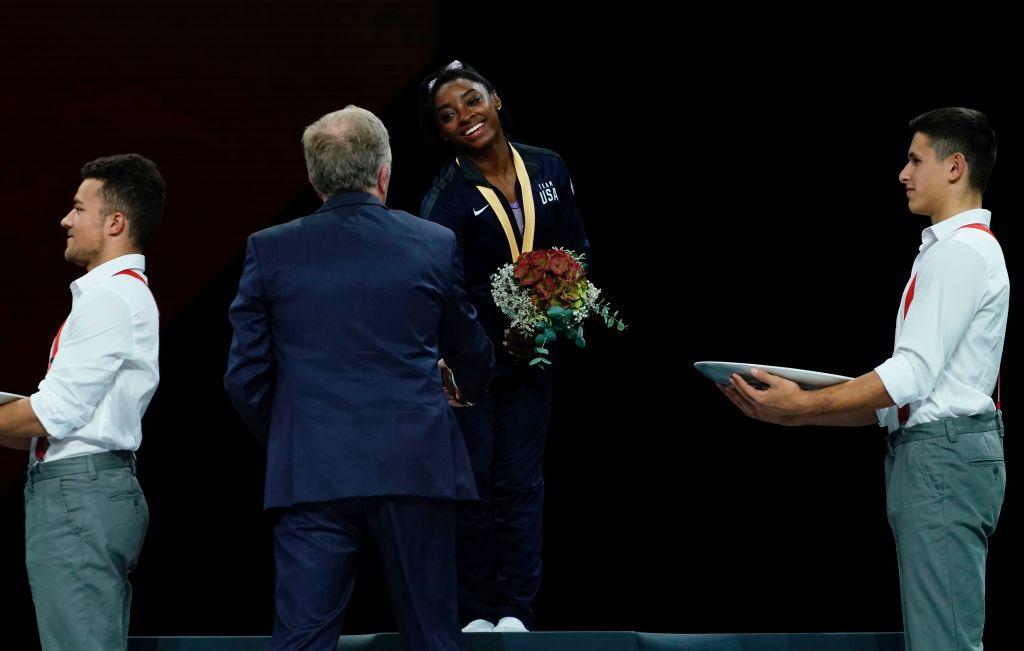 Biles poses on the podium after winning the floor event of the apparatus finals on Oct. 13, 2019. (©Getty Images | <a href="https://www.gettyimages.com.au/detail/news-photo/s-simone-biles-poses-on-the-podium-after-winning-the-floor-news-photo/1175586561">LIONEL BONAVENTURE / AFP</a>)