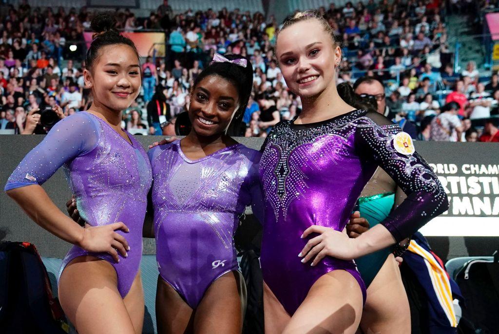 (L-R) USA's Sunisa Lee (2nd) USA's Simone Biles (1st) and Russia's Angelina Melnikova (3rd) pose after the floor event of the apparatus finals on Oct. 13, 2019 (©Getty Images | <a href="https://www.gettyimages.com.au/detail/news-photo/s-sunisa-lee-usas-simone-biles-and-russias-angelina-news-photo/1175578317">LIONEL BONAVENTURE/AFP</a>)