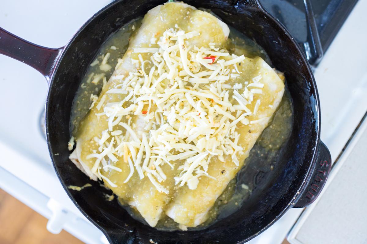 Bake the enchiladas in the same skillet you used to cook the filling. (Caroline Chambers)