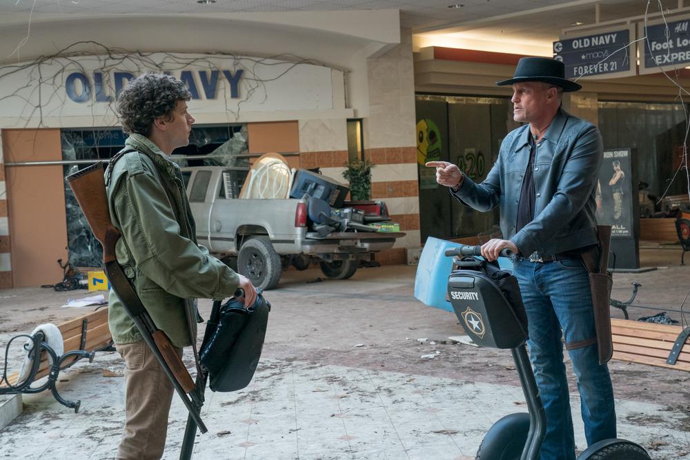 Columbus (Jesse Eisenberg, L) and Tallahassee (Woody Harrelson) in Columbia Pictures' “Zombieland 2: Double Tap.” Tallahassee demonstrates why Madison calls him "Paul Blart." (Jessica Miglio/Sony Pictures Entertainment Inc.)