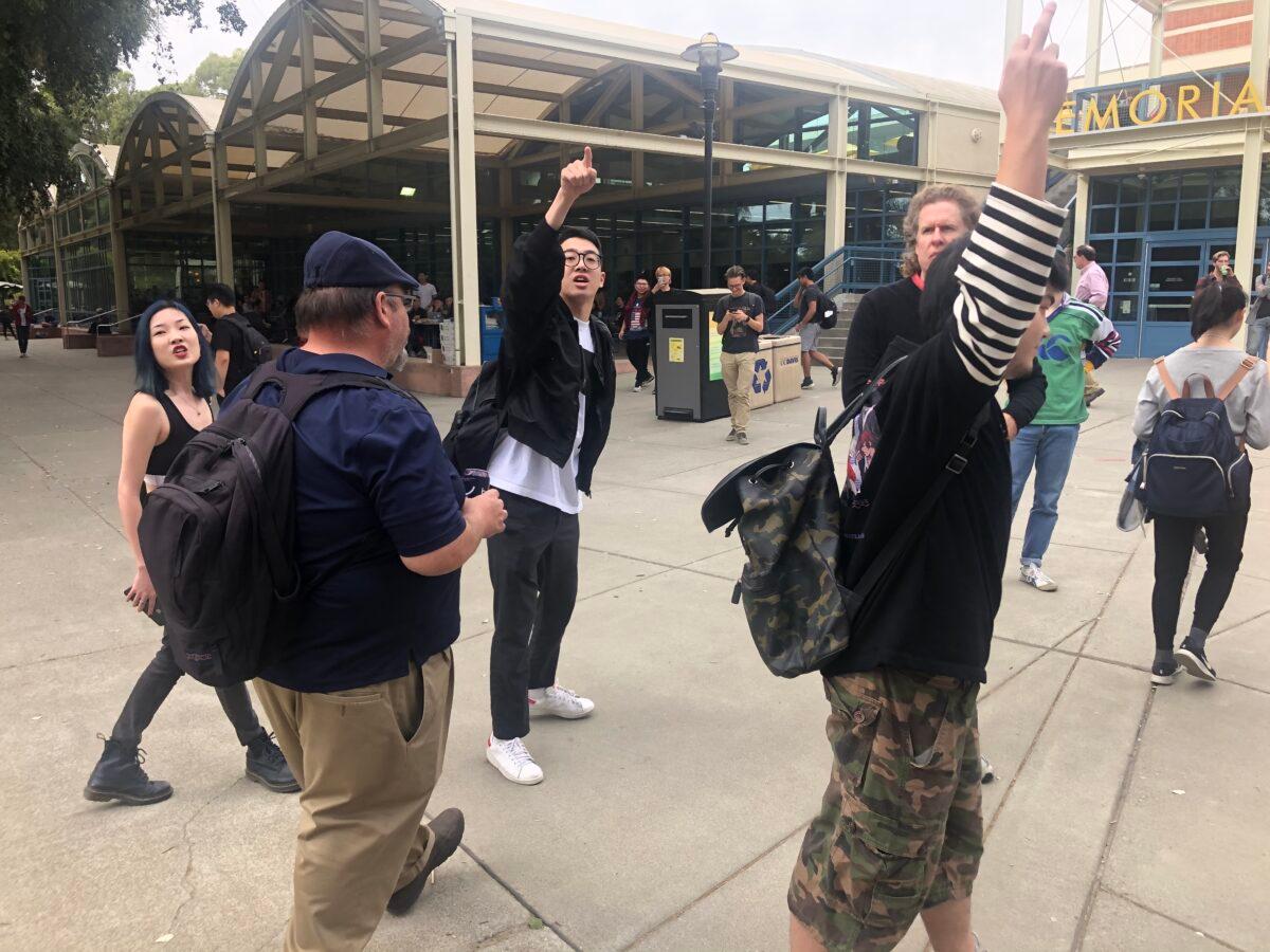Chinese students bullying Hong Kong pro-democracy students in San Francisco, Calif., in October 2019. (Nathan Su/The Epoch Times)