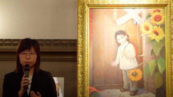 Hope Chen tells her story to visitors at the Art of Zhen Shan Ren International Exhibition at the University of Toronto in Canada on Oct. 17, 2019. (Screenshot/NTD News)
