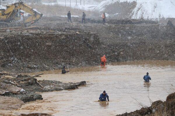 Rescuers work at the scene of the accident following a dam failure at a gold mine in Krasnoyarsk Region, Russia on Oct. 19, 2019. (Russian Emergencies Ministry in Krasnoyarsk Region/Handout via Reuters)