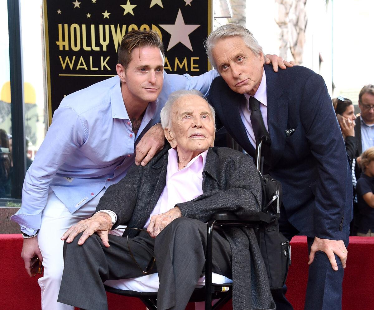 Cameron Douglas, Kirk Douglas, and Michael Douglas pose at the Michael Douglas Star On The Hollywood Walk Of Fame ceremony in Hollywood, California, on Nov, 6, 2018. (Gregg DeGuire/Getty Images)