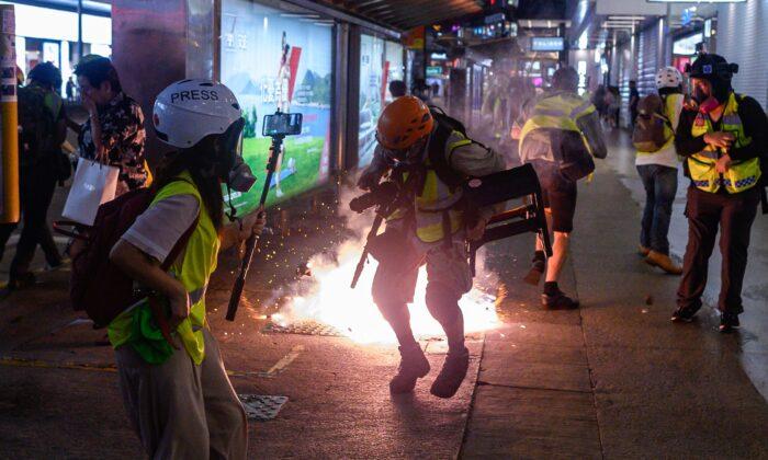 Hong Kong Police Switch to Flesh-Burning Tear Gas Made in China