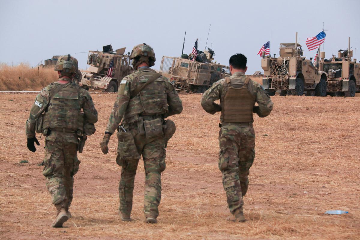 An. American military convoy stops near the town of Tel Tamr, north Syria on Oct. 20, 2019. (AP Photo/Baderkhan Ahmad)