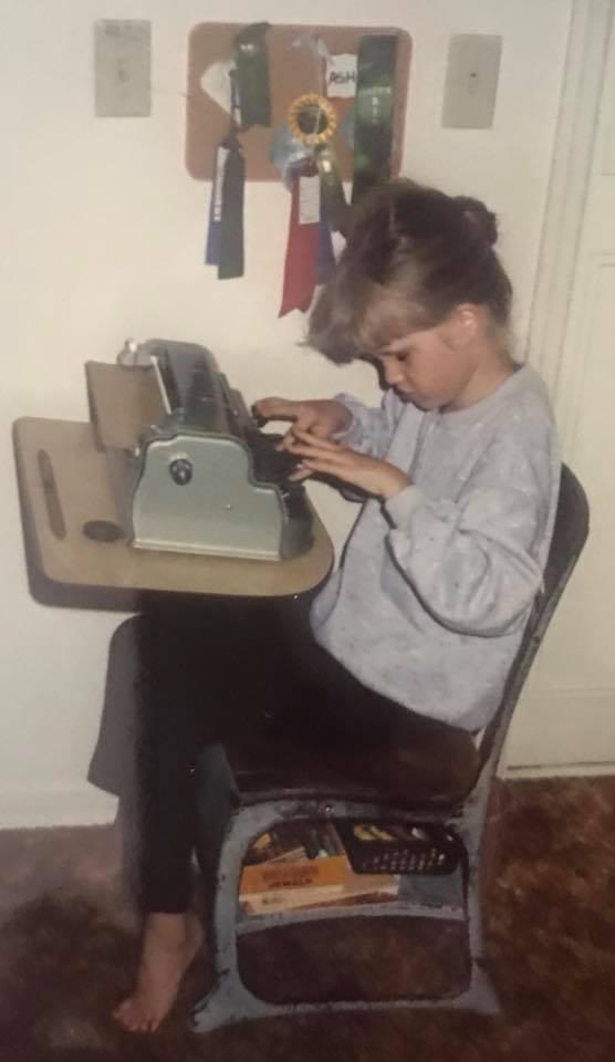 Ashley, around the age of 7, using the braille writer. (Photo courtesy of <a href="https://www.facebook.com/ABlindView/">Ashley Wayne</a>)