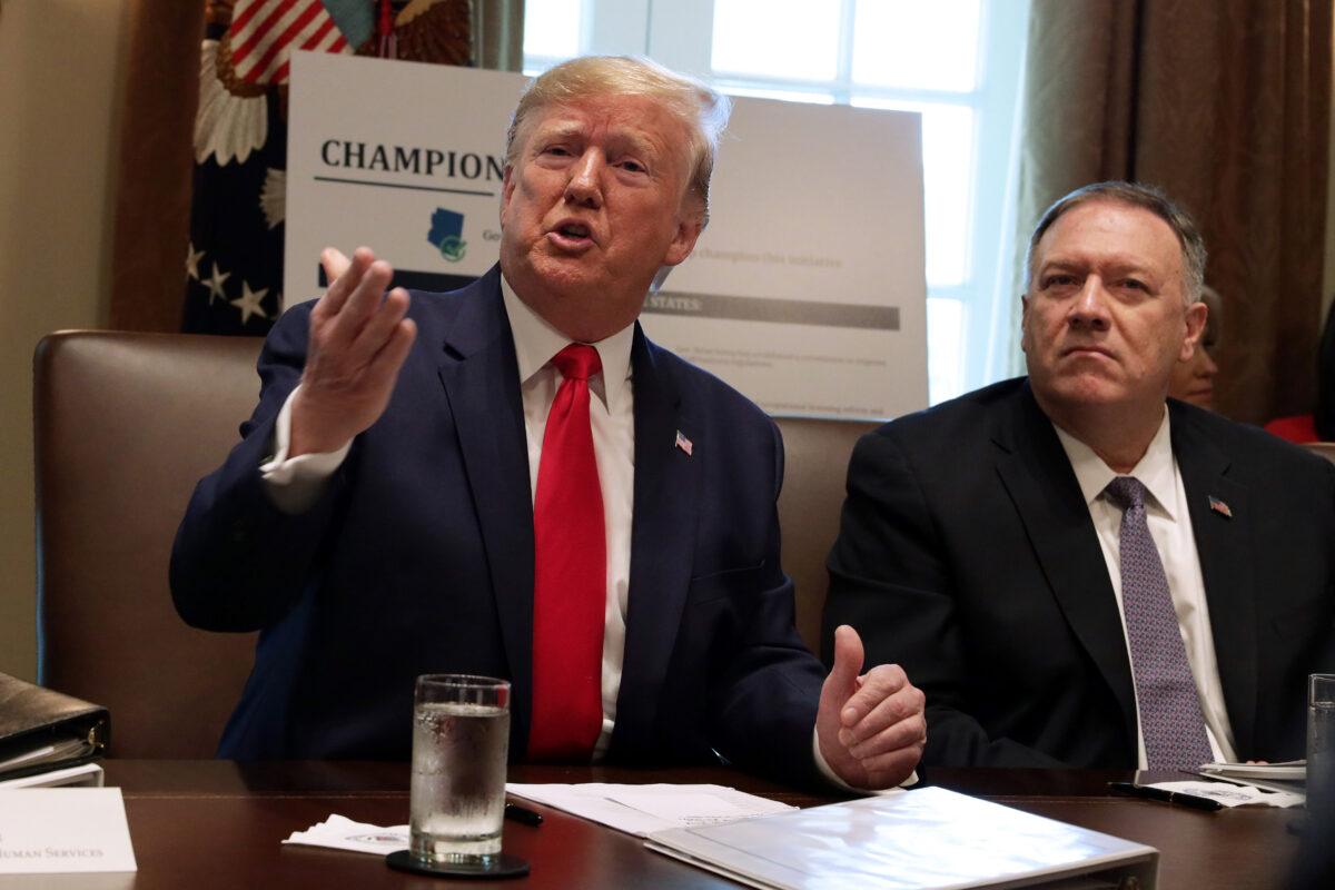 President Donald Trump speaks as Secretary of State Mike Pompeo listens during a cabinet meeting in the Cabinet Room of the White House in Washington on Oct. 21, 2019. (Alex Wong/Getty Images)