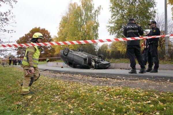 An overturned car is seen on the road, after it was allegedly struck by an ambulance which was stolen by an armed man in Oslo, Norway on Oct. 22, 2019. (NTB Scanpix/Hakon Mosvold Larsen via Reuters)