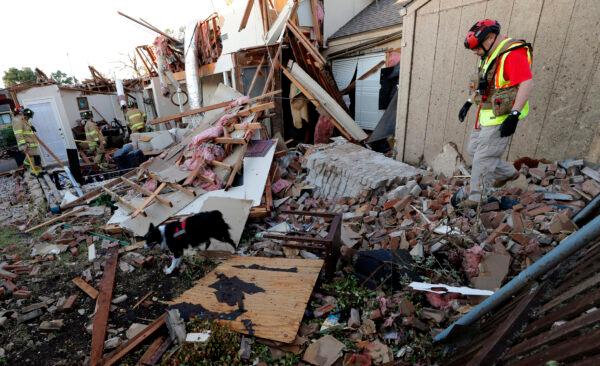 A search and rescue team checks a home after a tornado hit the neighborhood in Richardson, Texas on Oct. 21, 2019. (LM Otero/AP Photo)