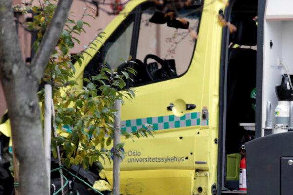 A damaged ambulance stands next to a building after an armed man who stole the vehicle was apprehended by police in Oslo, Norway on Oct. 22, 2019. (NTB Scanpix/Stian Lysberg Solum via Reuters)