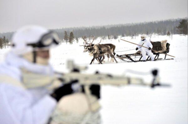 Russian servicemen of the Northern Fleet's Arctic mechanised infantry brigade participate in a military drill on riding reindeer and dog sleds near the settlement of Lovozero outside Murmansk, Russia, on Jan. 23, 2017. (Lev Fedoseyev/Ministry of Defence of the Russian Federation via REUTERS)