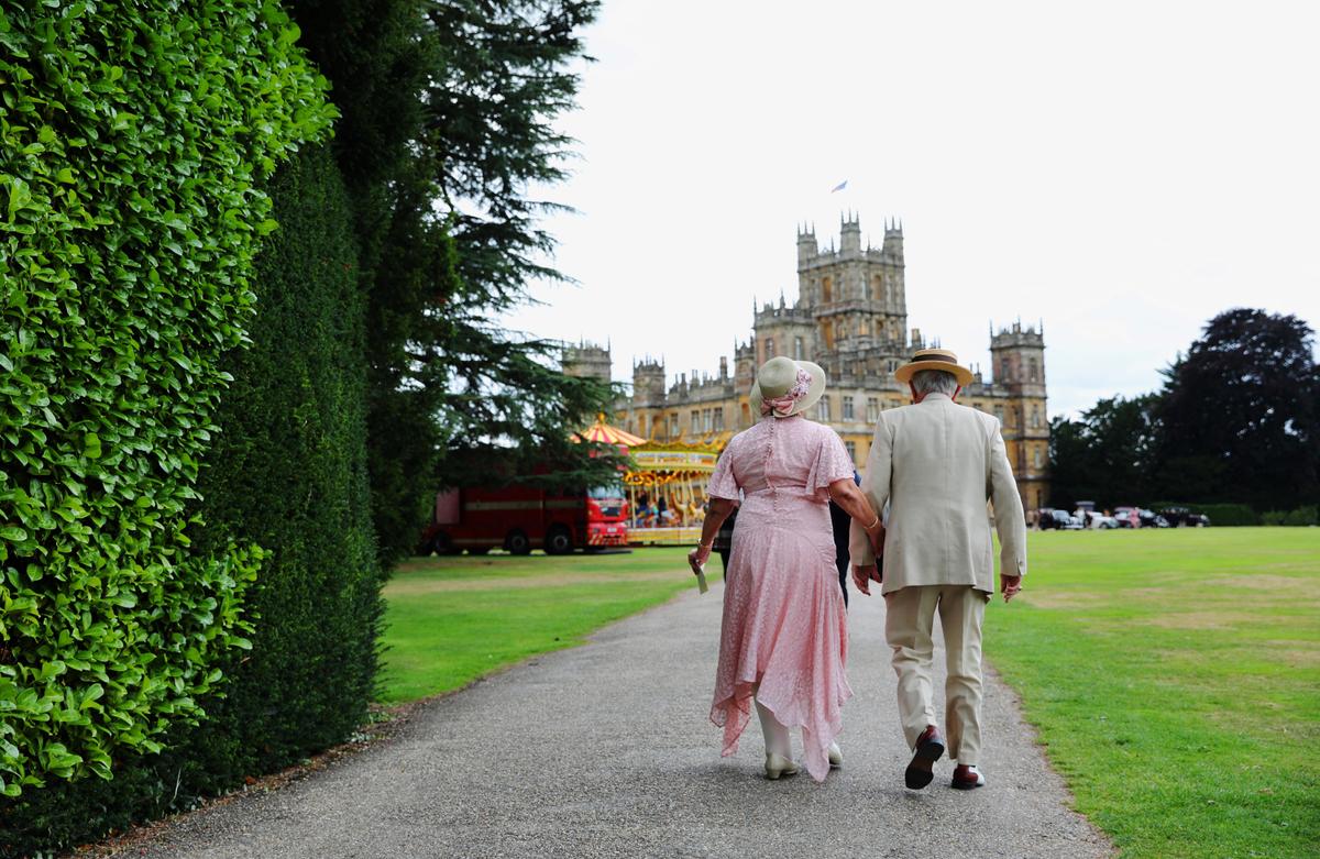 Visitors attend a 1920s themed event at Highclere Castle on Sept. 7, 2019, ahead of the world premiere of the "Downton Abbey" film. (ISABEL INFANTES/AFP/Getty Images)