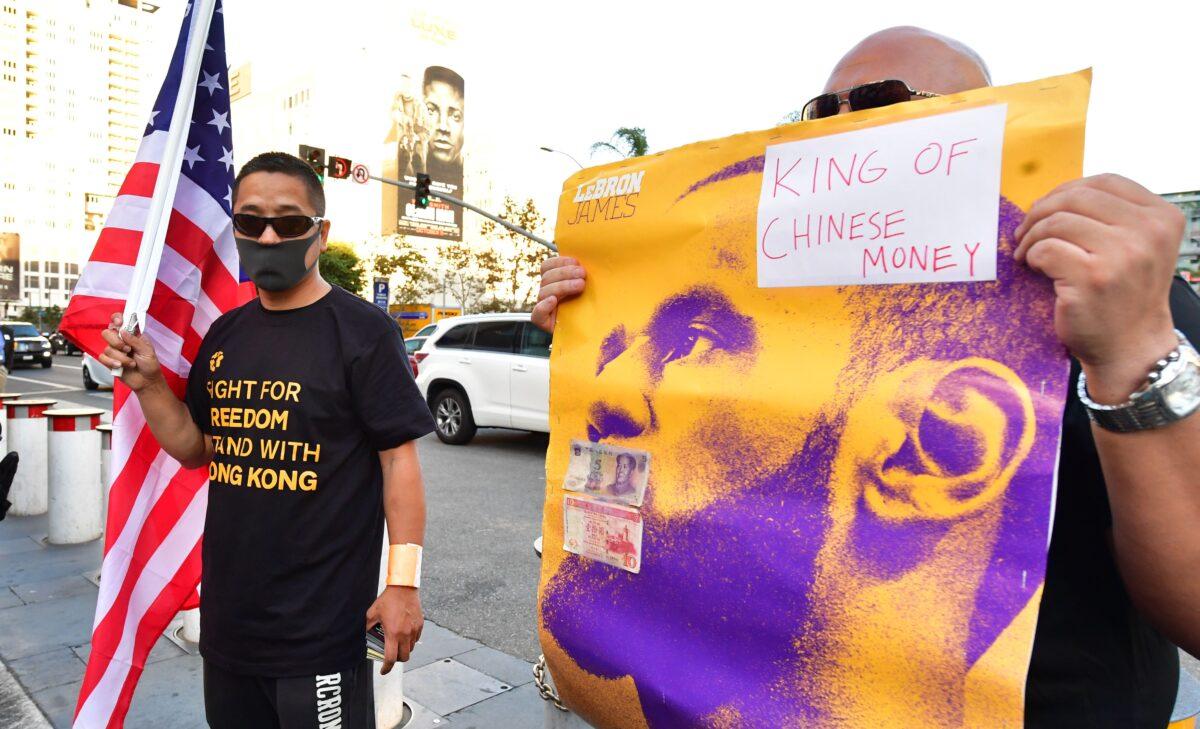 Anti-Chinese Communist Party activists protest outside Staples Center where free t-shirts were distributed supporting Hong Kong ahead of the Lakers vs Clippers NBA season opener in Los Angeles on Oct. 22, 2019. (Frederic J. Brown/AFP via Getty Images)