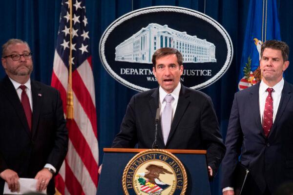 U.S. Assistant Attorney General for National Security John Demers (C) speaks during a press conference announcing the "China Initiative" to crack down on Chinese espionage at the Justice Department in Washington, on Nov. 1, 2018. (Jim Watson/AFP/Getty Images)