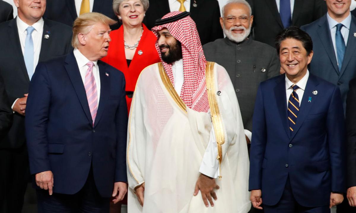 U.S. President Donald Trump speaks with Saudi Arabia's Crown Prince Mohammed bin Salman during a family photo session at G20 summit on June 28, 2019 in Osaka, Japan. (Kim Kyung-Hoon - Pool/Getty Images)