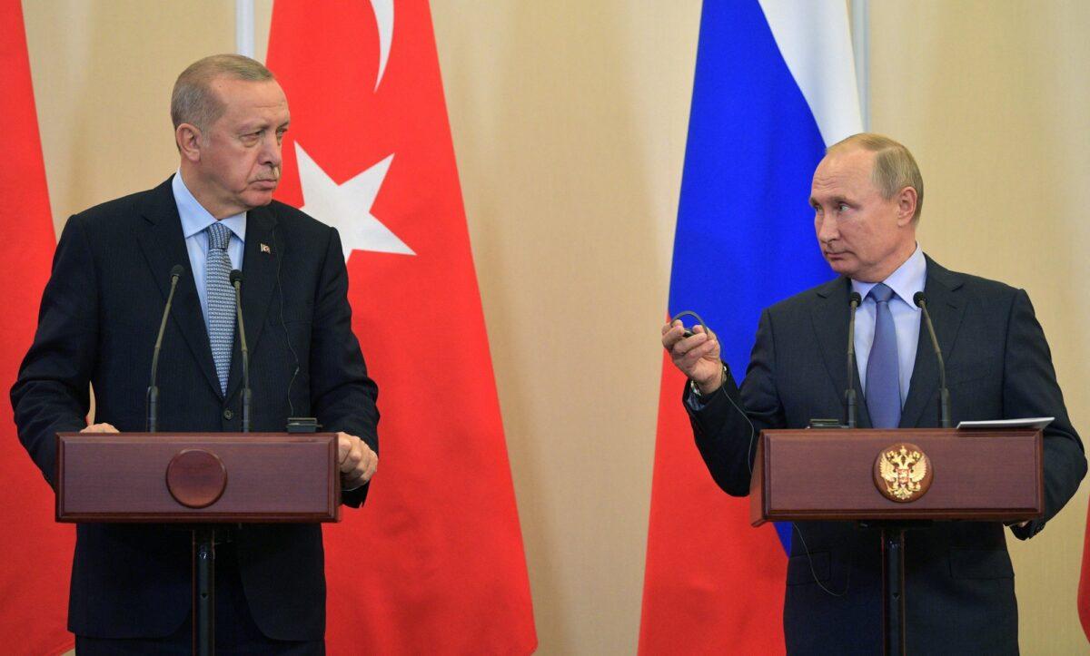 Russian President Vladimir Putin, right, and Turkish President Recep Tayyip Erdogan look at each other during a joint news conference after their talks in the Bocharov Ruchei residence in the Black Sea resort of Sochi, Russia on Oct. 22, 2019. (Alexei Druzhinin/Sputnik Kremlin Pool Photo via AP)