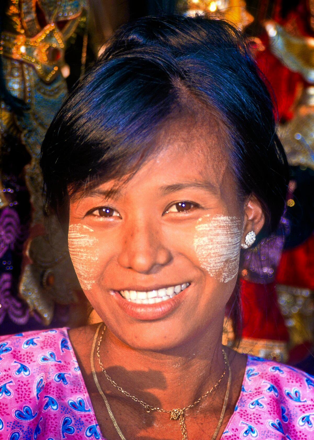 Most Burmese women decorate their faces with thanaka, a fragrant yellow sandalwood paste that is considered both a beauty mark and a sunscreen. (Fred J. Eckert)