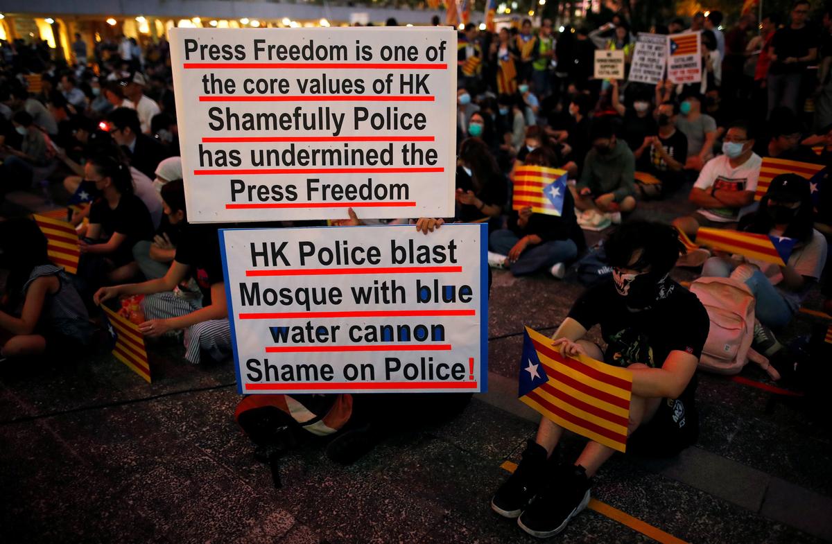 Pro-democracy demonstrators hold Esteladas (Catalan separatist flags) and banners as they gather in Hong Kong’s Chater Garden to show their solidarity with the Catalonian independence movement in Spain, in Hong Kong, China on Oct. 24, 2019. (Ammar Awad/Reuters)