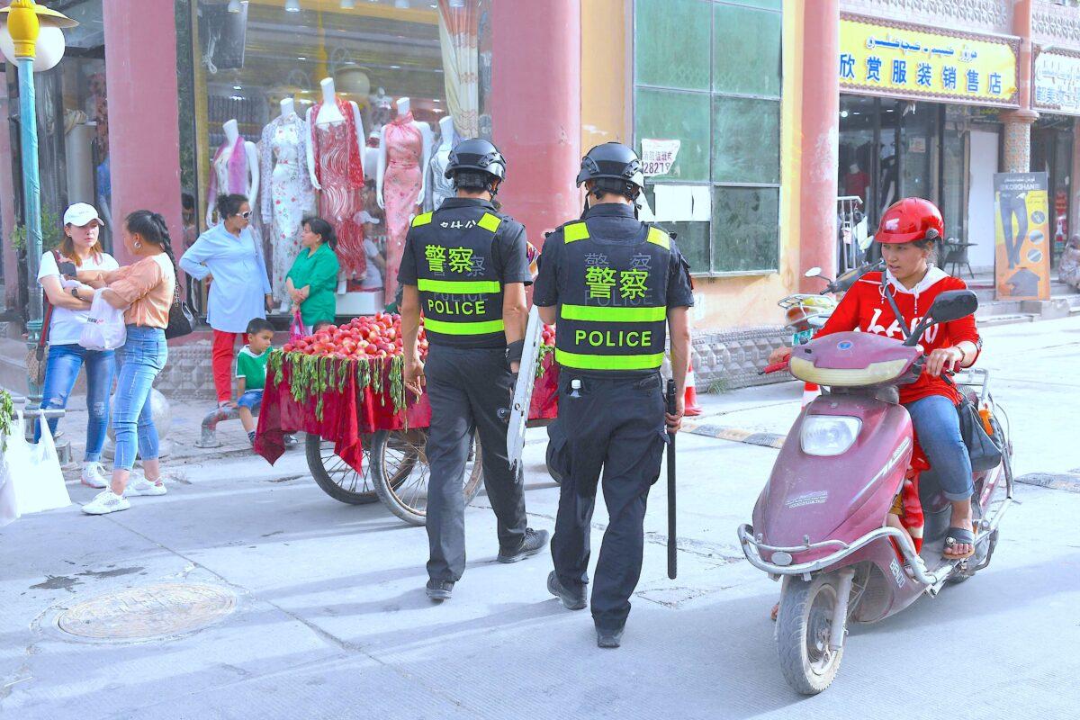 Police officers patrolling in Kashgar in China's western Xinjiang region on June 4, 2019. The recent destruction of dozens of mosques in Xinjiang highlights the increasing pressure Uyghurs and other ethnic minorities face in the heavily-policed region. (Greg Baker/AFP/Getty Images)
