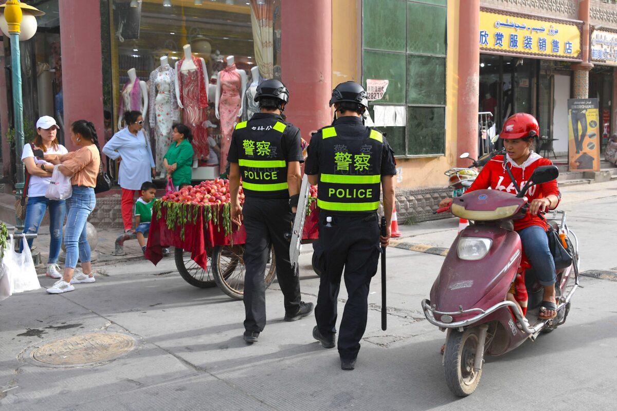 Police officers patrol in Kashgar, western Xinjiang, China, on June 4, 2019. (Greg Baker/AFP/Getty Images)