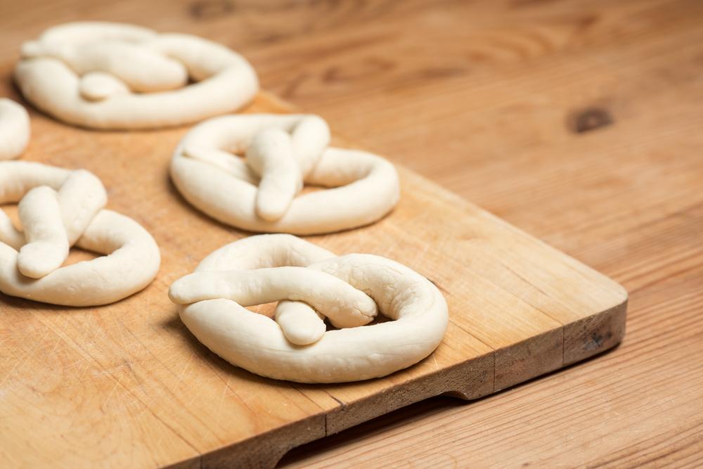 Let your guests roll out the dough and shape their own pretzels. (Shutterstock)
