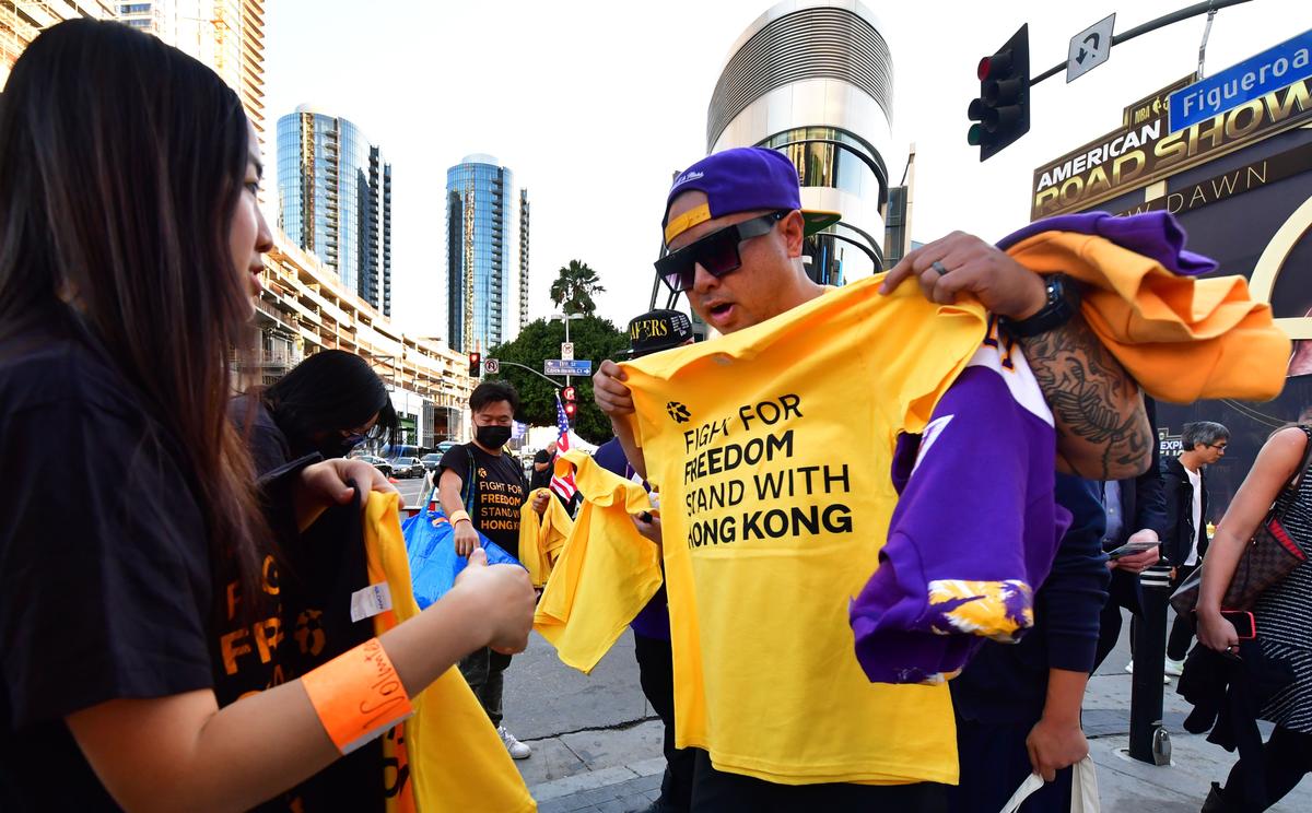 Hong Kong supporters hand out free t-shirts outside Staples Center ahead of the Lakers vs Clippers NBA season opener in Los Angeles on Oct. 22, 2019. (Frederic J. Brown/AFP via Getty Images)