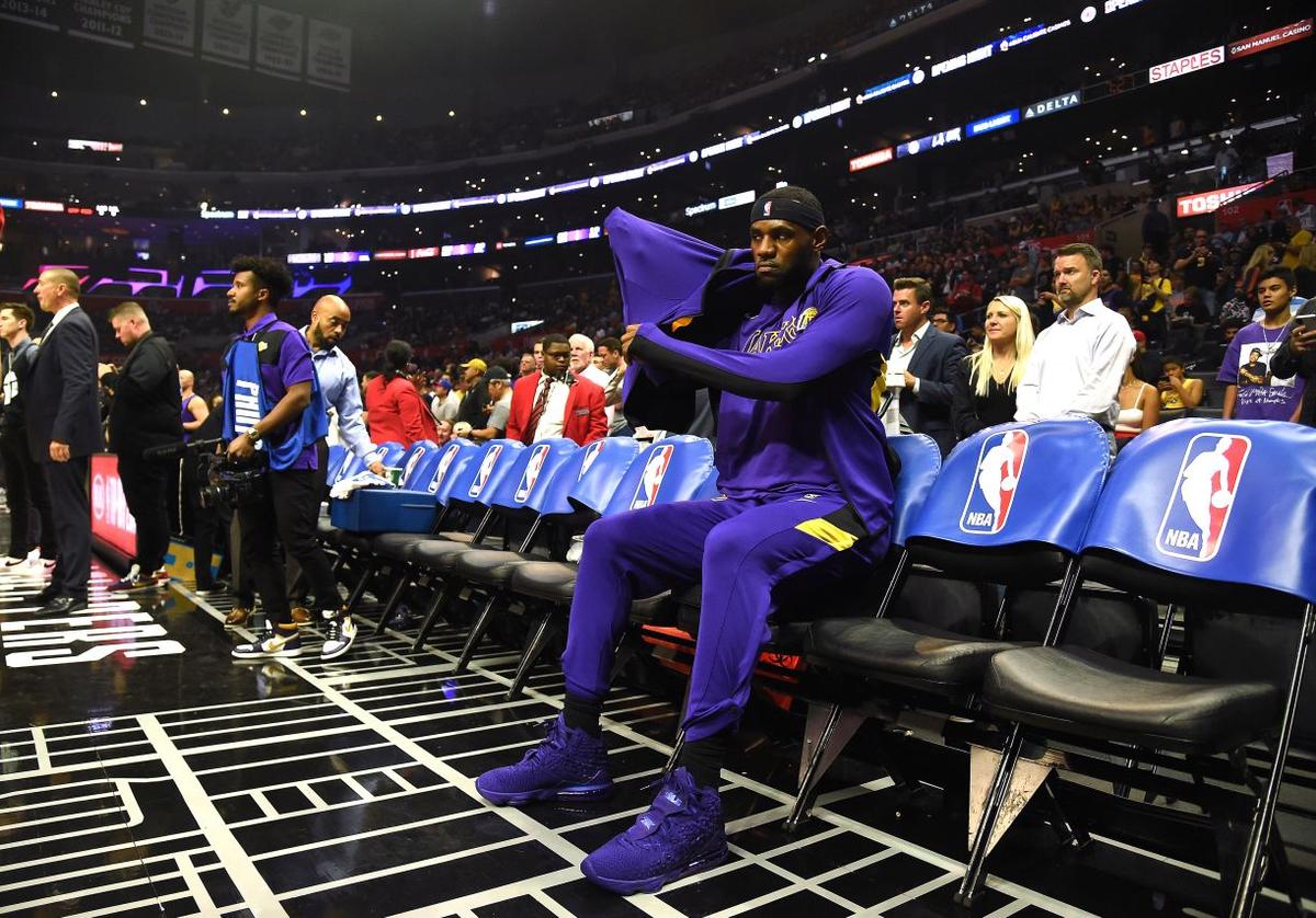  LeBron James #23 of the Los Angeles Lakers sits during warm up before the game against the LA Clippers in the LA Clippers season home opener at Staples Center in Los Angeles on Oct. 22, 2019. (Harry How/Getty Images)