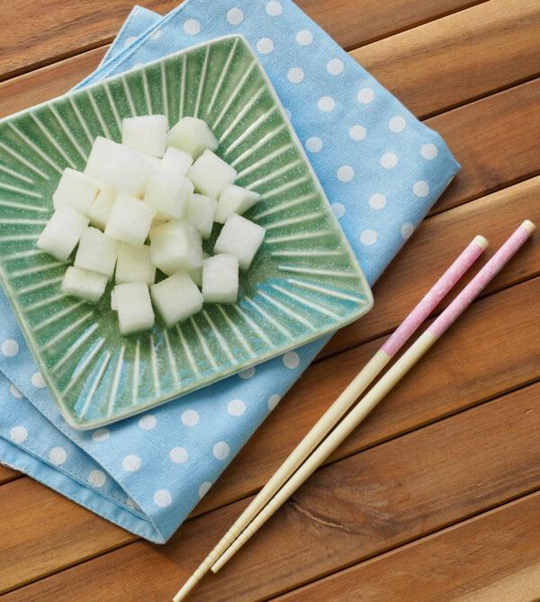(Inset) Pickled radish cubes, crisp and refreshing, are a common accompaniment. (Shutterstock)