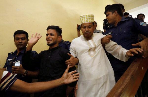 Accused people are taken out of the court premises after they were given death sentences in a murder case in Feni, Bangladesh on Oct. 24, 2019. (Stringer/Reuters)