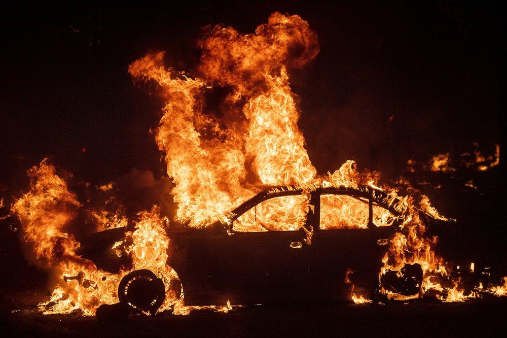 Flames from the Kincade Fire consume a car in the Jimtown community of unincorporated Sonoma County, Calif., on Oct. 24, 2019. (AP Photo/Noah Berger)