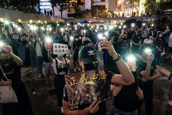 Pro-democracy supporters light up their cell phones as they take part in a rally of medical professionals in Central district in Hong Kong, on Oct. 26, 2019. (Anthony Kwan/Getty Images)