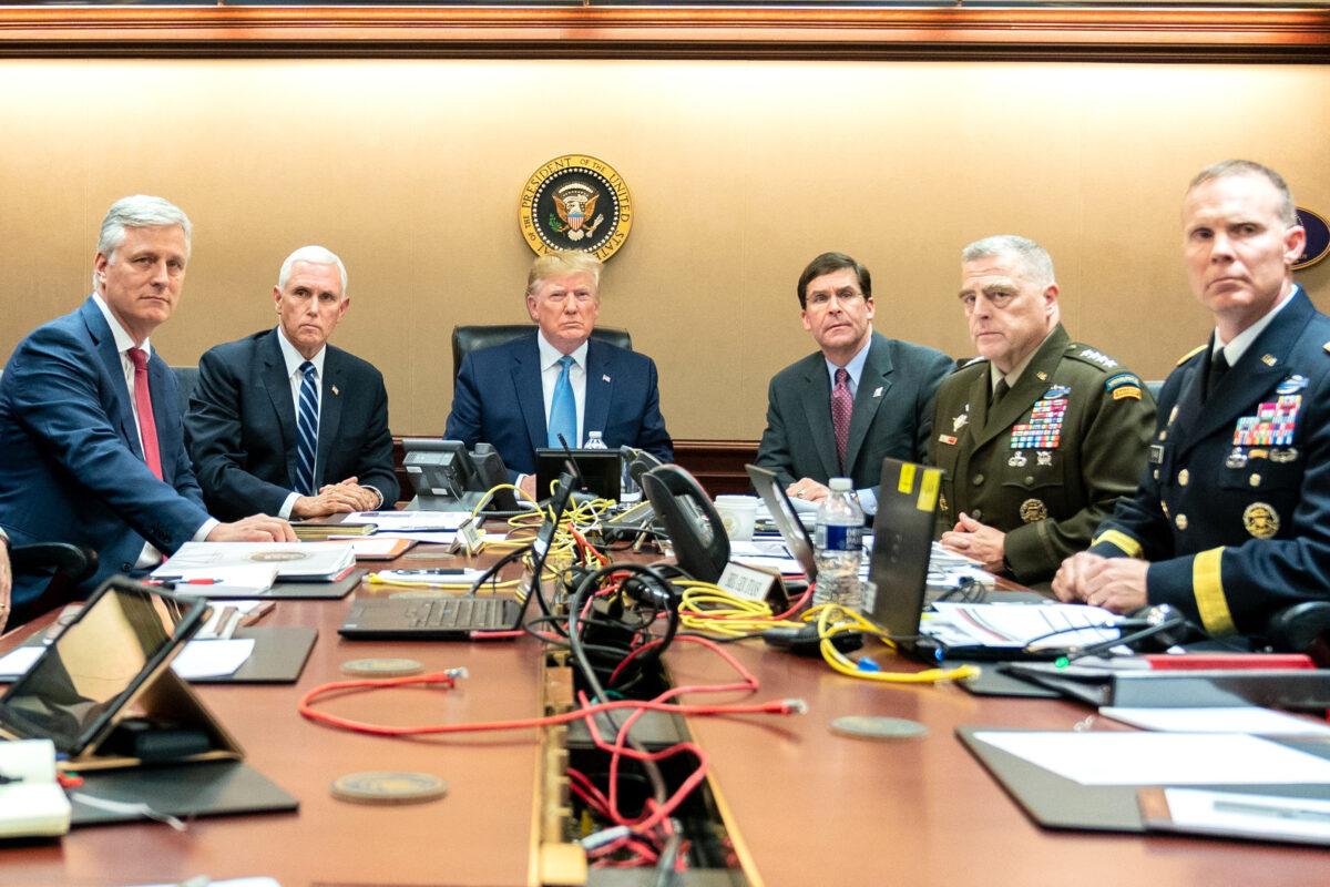 President Donald Trump is joined by Vice President Mike Pence (2nd L), National Security Advisor Robert O'Brien (L), Secretary of Defense Mark Esper (3rd R), Chairman of the Joint Chiefs of Staff U.S. Army General Mark A. Milley (2nd R) and Brig. Gen. Marcus Evans, Deputy Director for Special Operations on the Joint Staff in the Situation Room of the White House, monitoring developments in the U.S. Special Operations forces raid that took out ISIS terrorist leader Abu Bakr al-Baghdadi, on Oct. 26, 2019. (Shealah Craighead/The White House via Getty Images)
