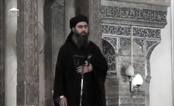A man purported to be the reclusive leader of the extremist group ISIS Abu Bakr al-Baghdadi has made what would be his first public appearance at a mosque in the centre of Iraq's second city, Mosul, according to a video recording posted on the Internet on July 5, 2014, in this still image taken from video. (Social Media Website via Reuters TV/File Photo)