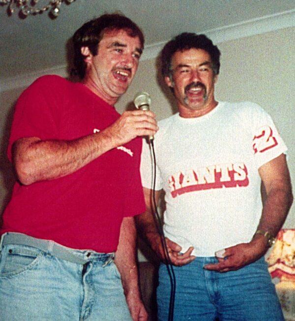 An undated supplied image shows backpacker murderer Ivan Milat and his brother Richard singing at a family gathering. (AAP Image/Supplied)