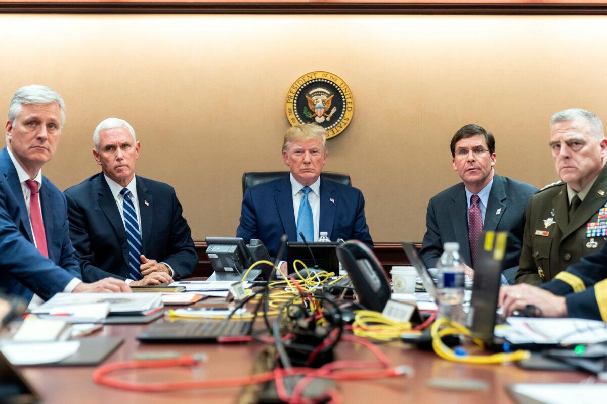 President Donald Trump is joined by Vice President Mike Pence, second from left, national security adviser Robert O’Brien, left; Secretary of Defense Mark Esper, second from right, and Chairman of the Joint Chiefs of Staff Army Gen. Mark A. Milley, right, on Oct. 26, 2019, in the Situation Room of the White House monitoring developments in the U.S. Special Operations forces raid that took out Islamic State leader Abu Bakr al-Baghdadi. (Shealah Craighead/White House via AP)