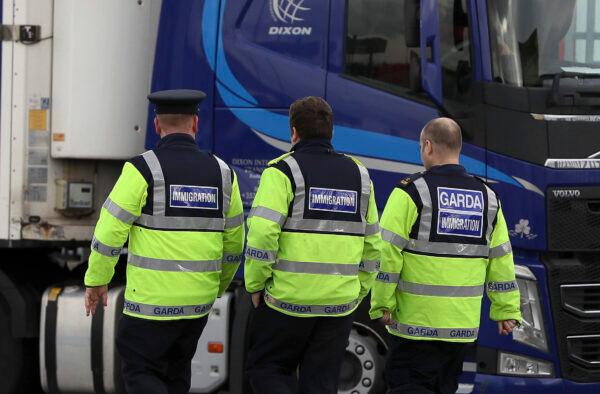 Garda immigration officers at Dublin Port, Ireland, on Oct. 23, 2019, that is reported to have been the likely exit point for a truck containing 39 people, to journey from Europe to the British ferry port at Holyhead in Wales. (Brian Lawless/PA via AP)