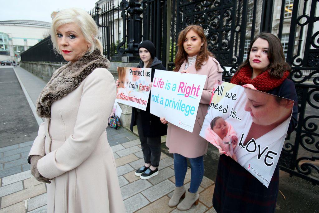 Bernadette Smyth (L), founder of pro-life campaign group Precious Life, stands with anti-abortion activists holding placards outside Belfast High court on Jan. 30, 2019. (©Getty Images | <a href="https://www.gettyimages.com.au/detail/news-photo/bernadette-bernie-smyth-founder-of-pro-life-campaign-group-news-photo/1091216138">PAUL FAITH/AFP</a>)