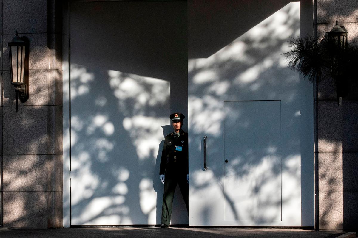A Chinese paramilitary soldier secures an entrance to Jingxi hotel where the CCP elites are holding their fourth plenary session in Beijing on Oct. 28, 2019. (Nicolas Asfouri/AFP via Getty Images)