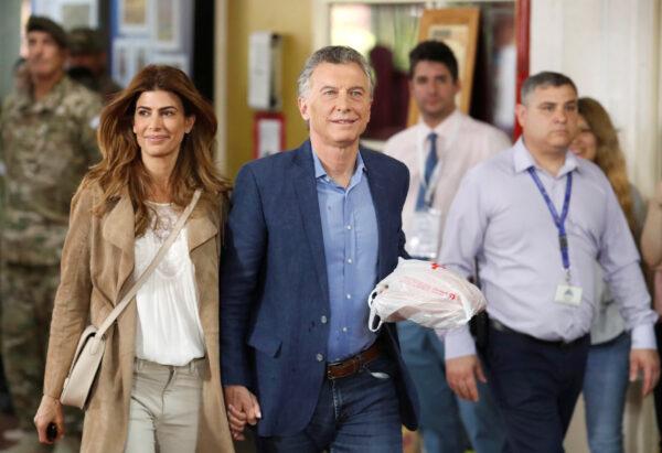Argentina's President Mauricio Macri, who is running for reelection, arrives with his wife and first lady Juliana Awada at a polling station in Buenos Aires, Argentina, on Oct. 27, 2019. (Carlos Garcia Rawlins/Reuters)