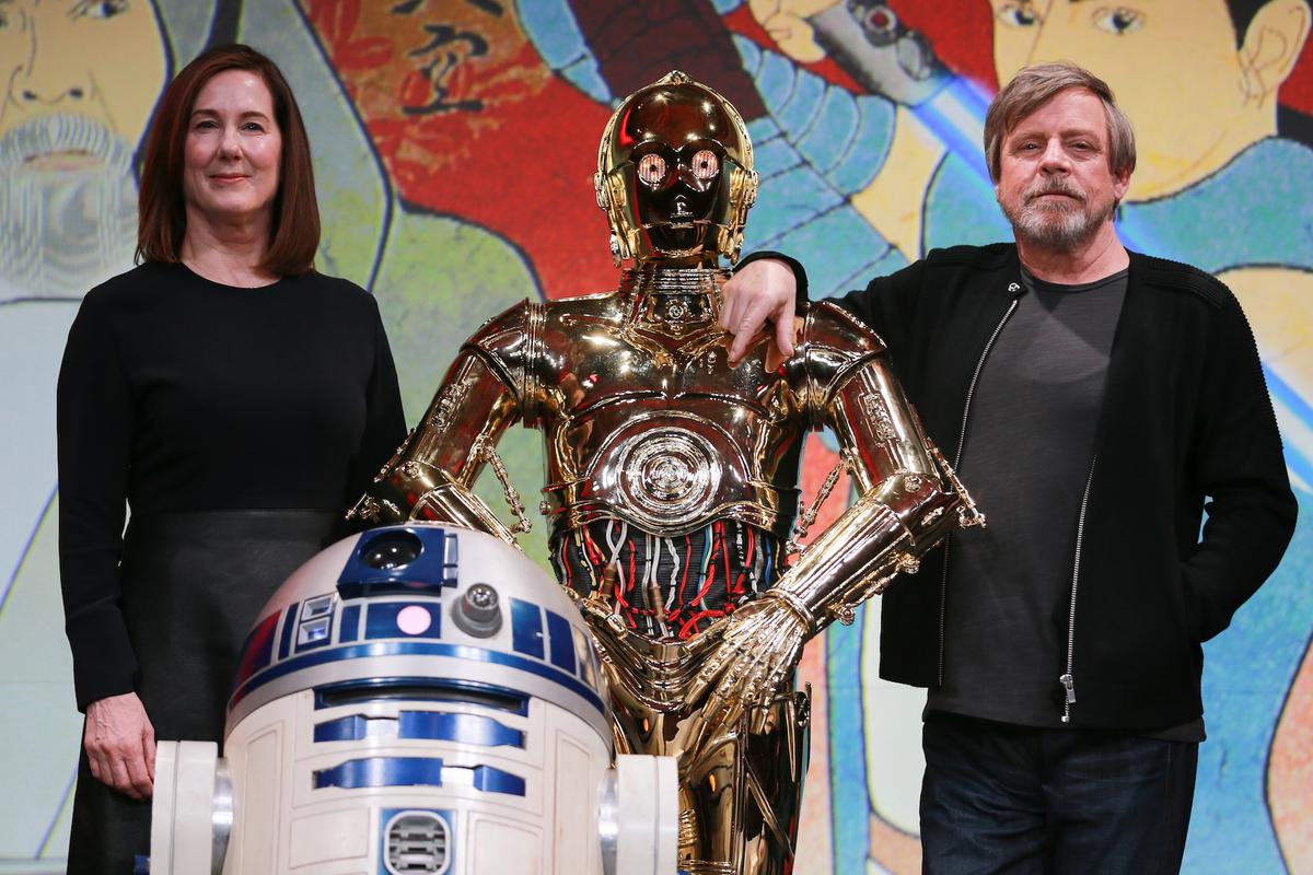 (L-R) Producer Kathleen Kennedy, C-3PO, and Mark Hamill attend the "Star Wars: The Last Jedi" press conference at the Ritz Carlton Tokyo in Tokyo on Dec. 7, 2017. (Christopher Jue/Getty Images for Disney)