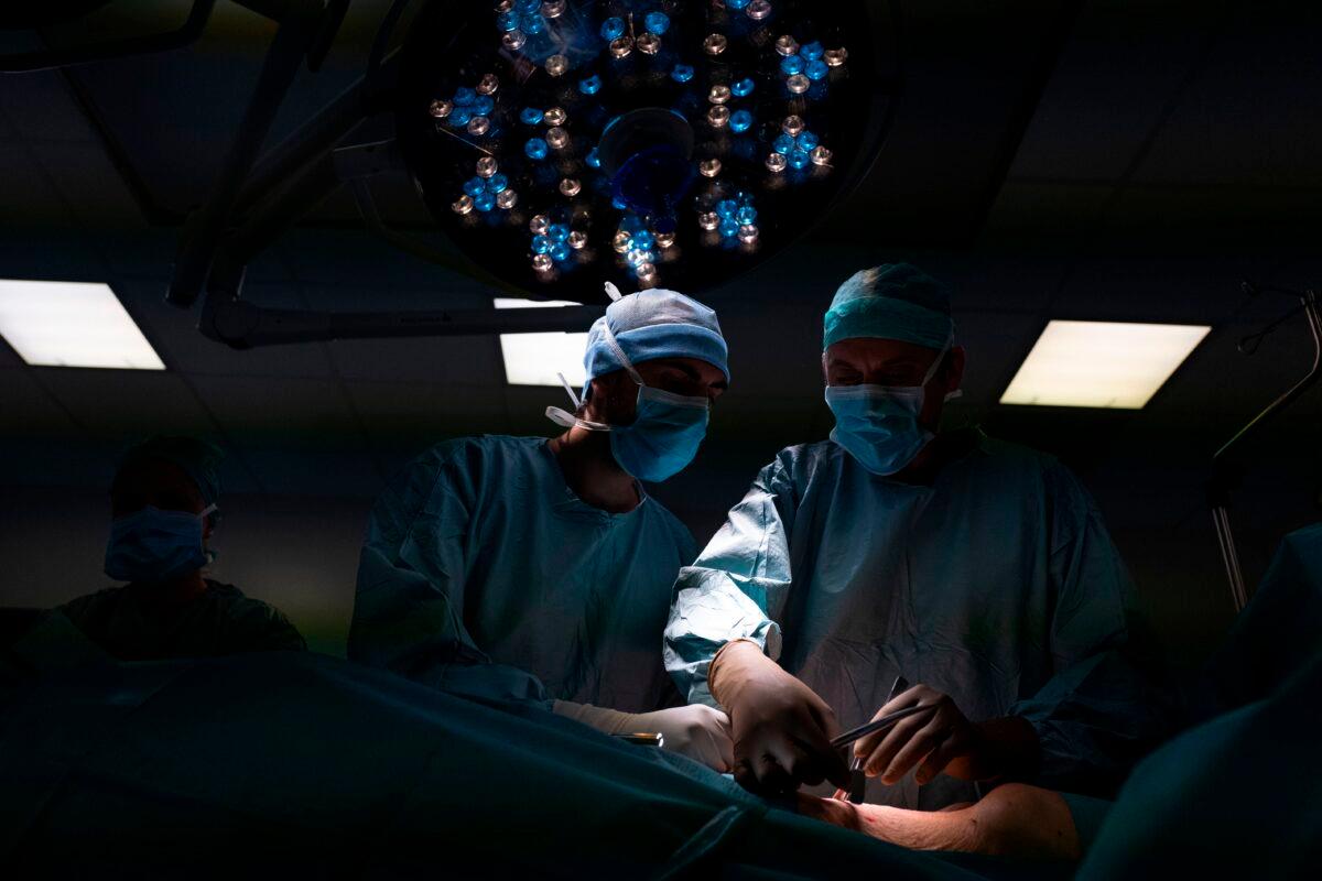 Surgeons operate on a patient with pancreatic cancer in a file photograph. (Romain Lafedregue/AFP/Getty Images)