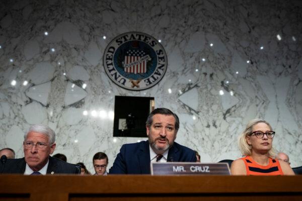 (L-R) Commerce Committee chairman Sen. Roger Wicker (R-Mass.), subcommittee chairman Sen. Ted Cruz (R-Texas) and subcommittee ranking member Sen. Krysten Sinema (D-Ariz.) at a Senate Commerce Subcommittee in the Hart Senate Office Building, March 27, 2019, in Washington, DC. (Drew Angerer/Getty Images)