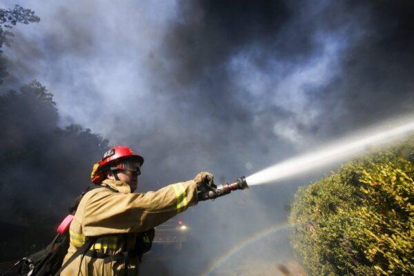 A firefighter battles a wildfire near a ranch in Simi Valley, Calif., on Oct. 30, 2019. (Ringo H.W. Chiu/ AP)