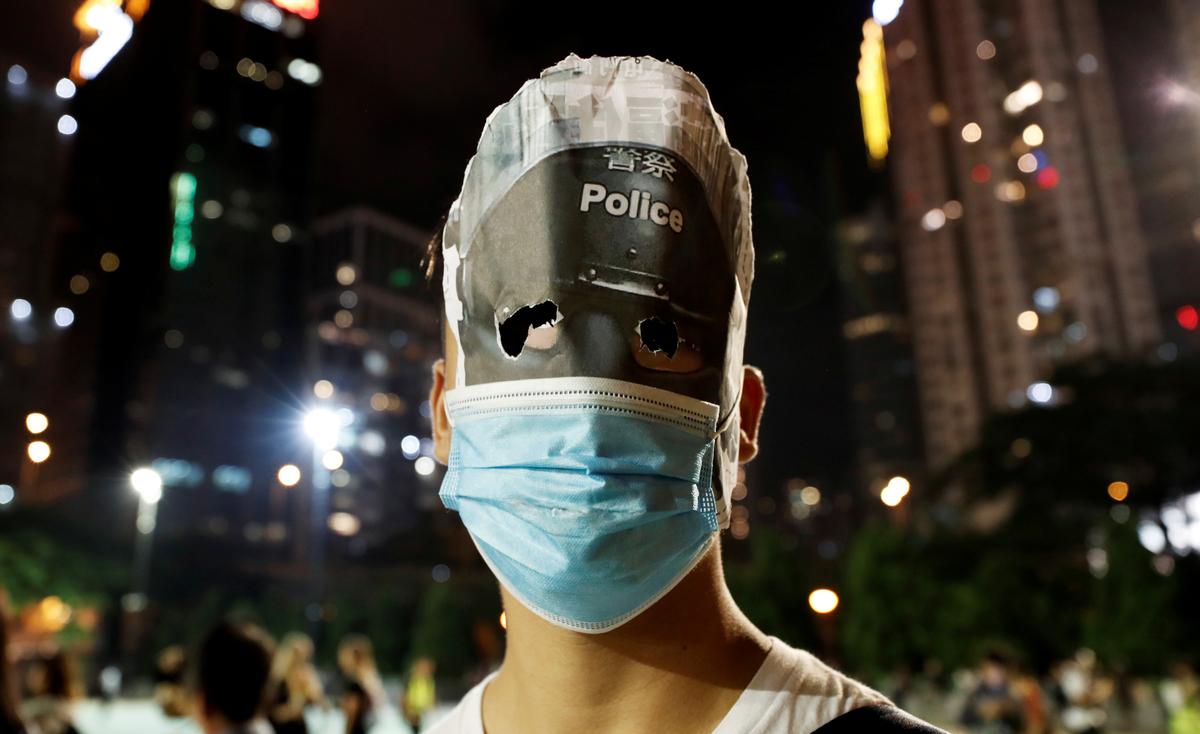 An anti-government protester wearing a mask attends a march during Halloween in Victoria Park, Hong Kong, China on Oct. 31, 2019. (Shannon Stapleton/Reuters)